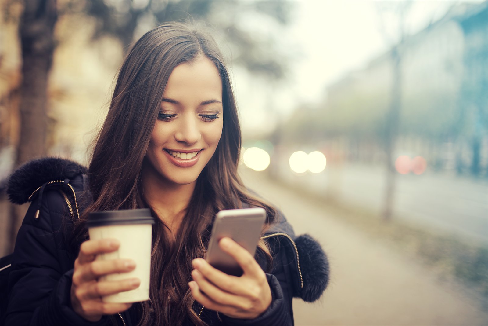 Woman holding coffee for Crays Coffee